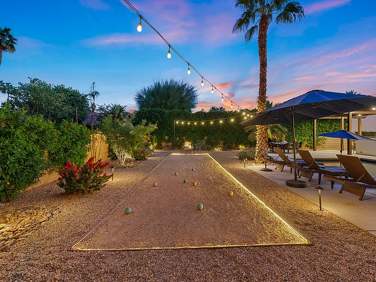 The backyard is greatly illuminated for your evening enjoyment.