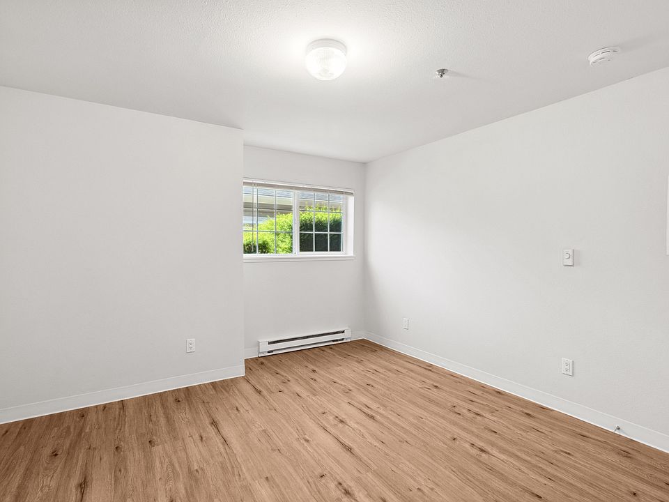 Bright, open bedroom with natural light.