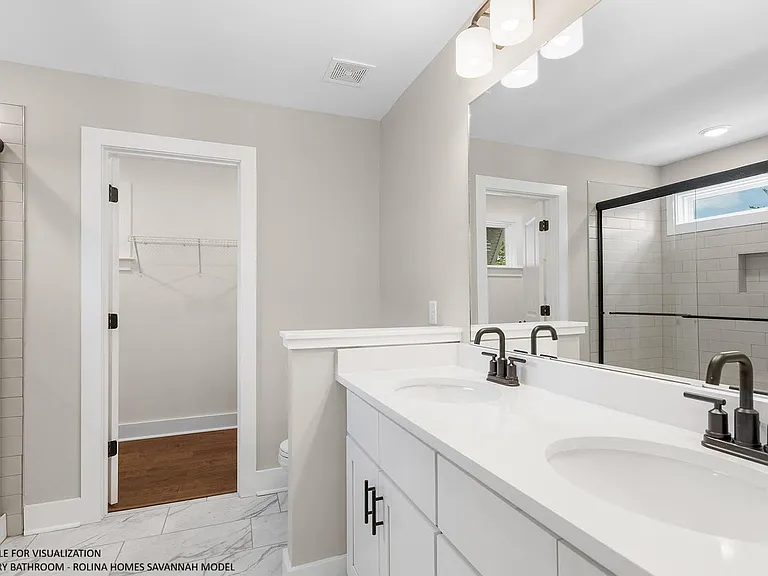 PRIMARY BATHROOM PICTURE FROM A DIFFERENT SAVANNAH MODEL RECENTLY BUILT BY ROLINA HOMES