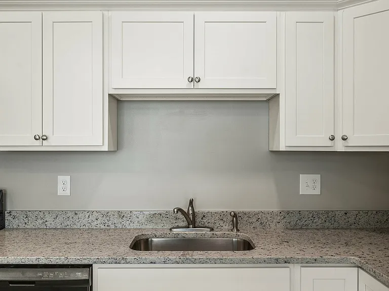 Explore this elegant kitchen, blending style and functionality with its sleek design.