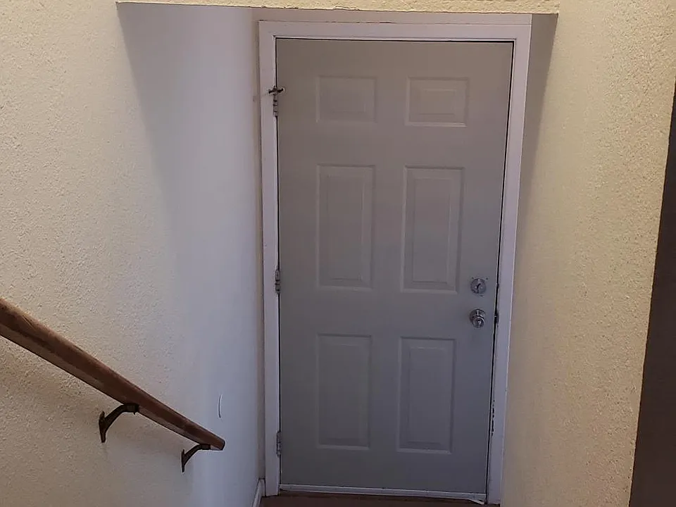 Stairway down to front door.