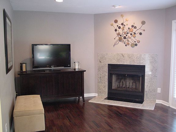 Brazilian Cherry wood floors and marble fireplace