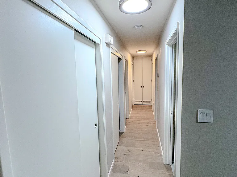 Hallway with closet storage