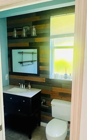 Bathroom #3: Pool bath and bathroom to the third bedroom. Has shelving, and glass enclosed shower stall.