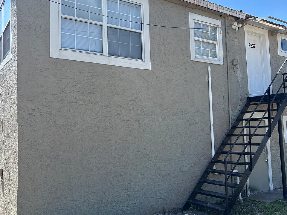 Outside View, Stairs shown leading up to the unit.