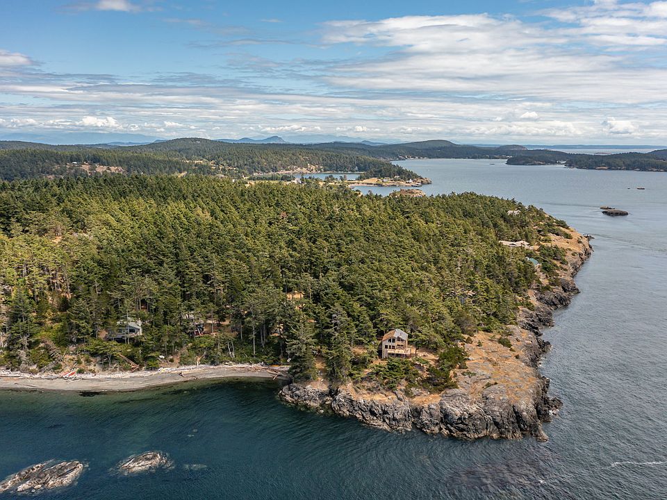 Stunning location overlooking Davis Bay on Lopez Island. Medium bank waterfront on rocky point.