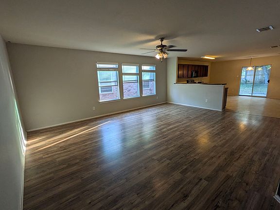 huge living room open to kitchen and dining