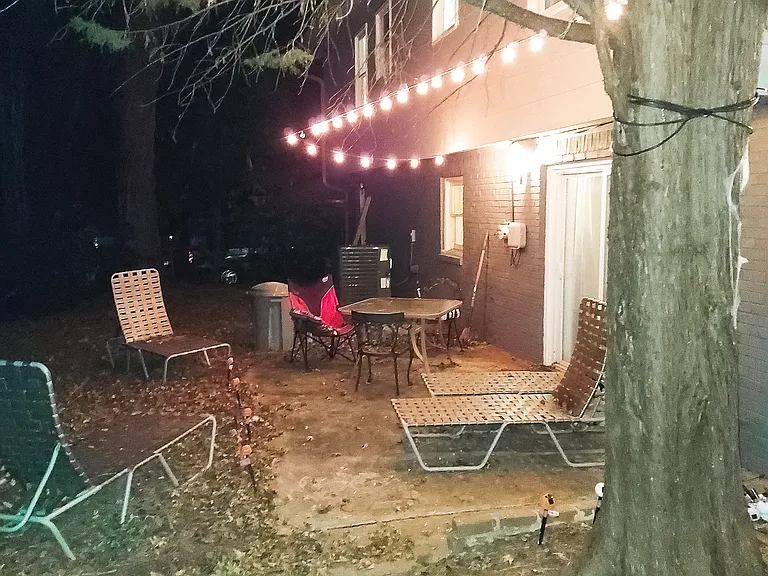 Nice backyard patio with table and lights