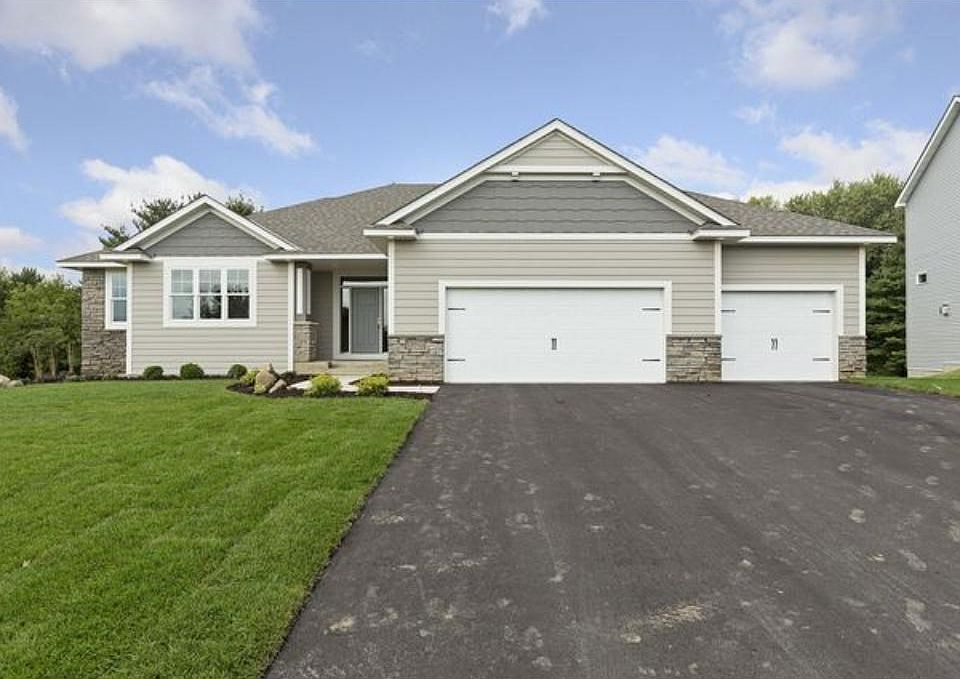 Award winning, custom-built, executive rambler in highly sought after North Lakeville neighborhood.