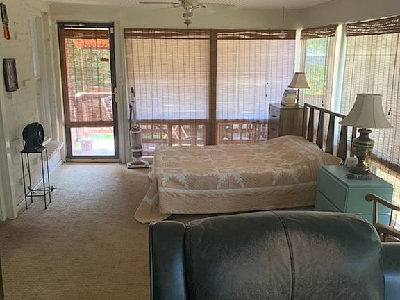 View from the other side of the sunroom! You can access the main house through a door that connects to breakfast room, kitchen, and main floor bathroom.