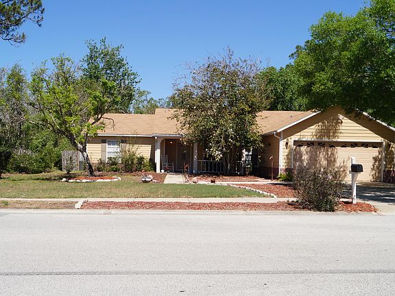 Front view of house and yard from street view