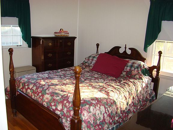 Bedroom one with hardwood floor