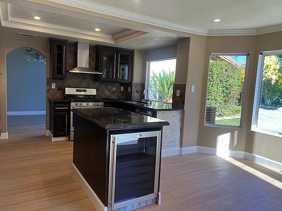 Kitchen _ Island With Wine Cooler & Backyard View
