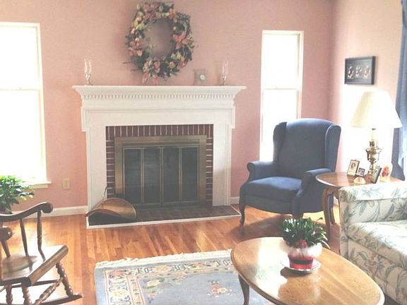 br /The Living Room is nicely sized, the fireplace has windows on each side.br /Notice the beautiful hardwood floor.