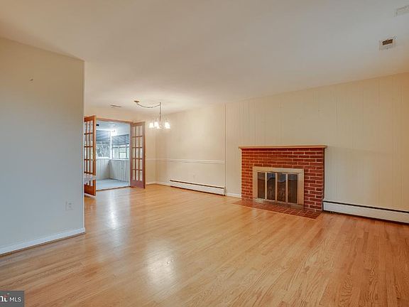 Entry living room wood burning fireplace