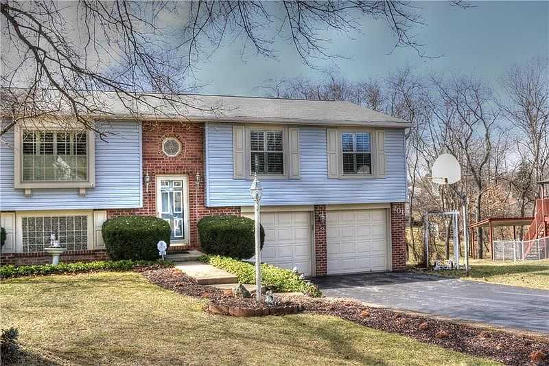 Immaculate home on Briarwood has plenty of parking for extra cars in the driveway.  Accent window over the front door adds more 