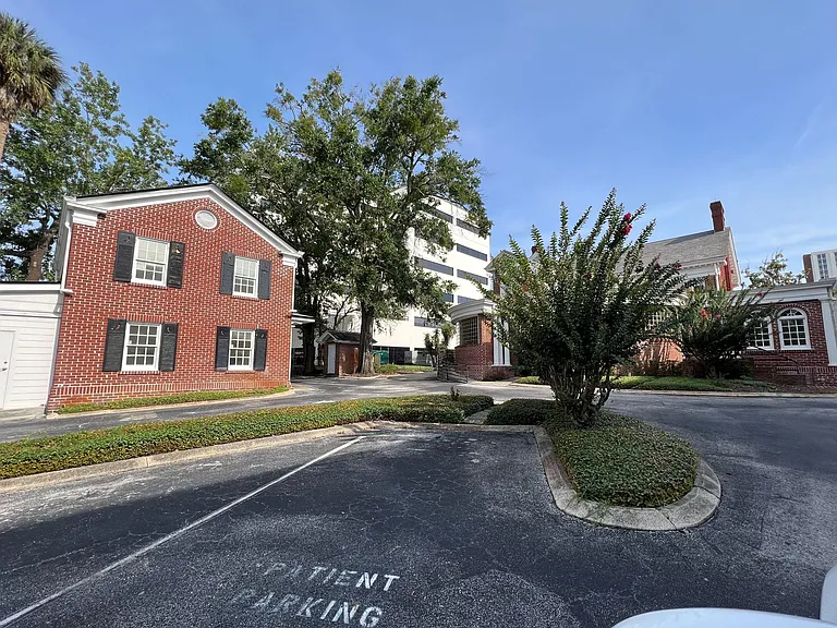 Cottage behind patient parking for Medical Office