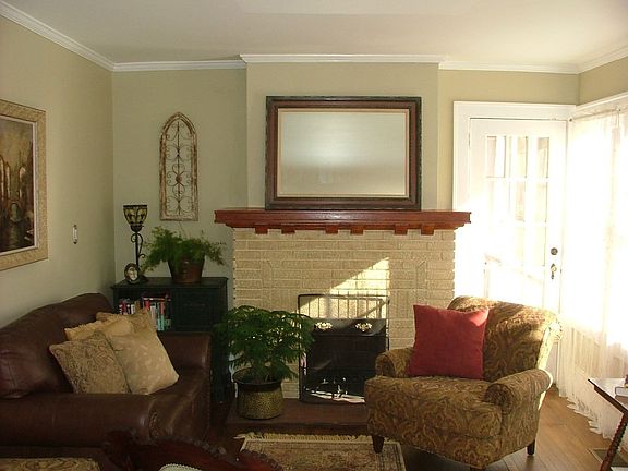 Family Room with Wood Burning Fireplace and Sunroom  Accessible.
