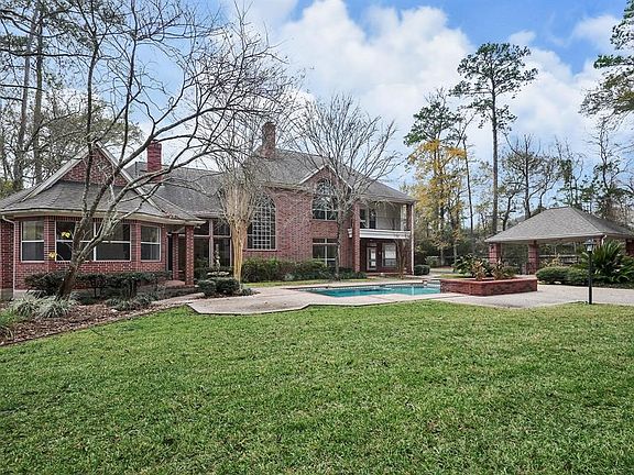 The expansive backyard offers plenty of room for play.