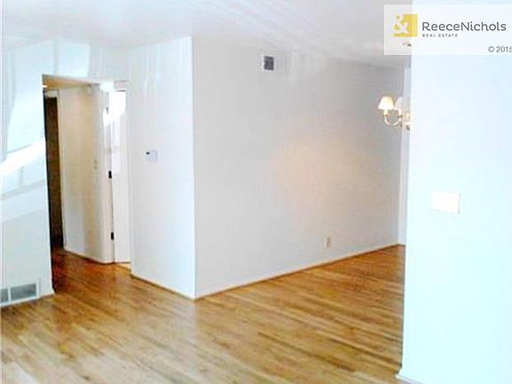 Living Room & Dining Room Leading to Hallway with Bath and Bedro