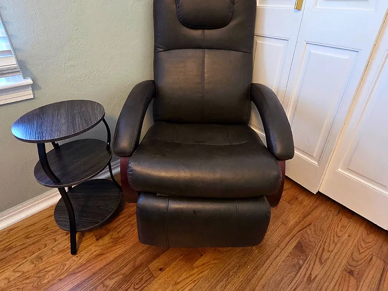 Cozy accent chair with side table perfect for reading or relaxing
