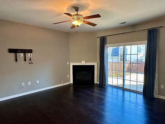 Gas Fireplace & sliding glass door out to fully fenced-in backyard