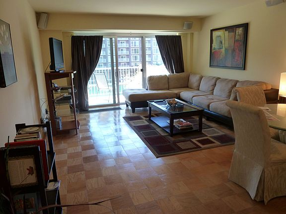 Living room w/ balcony beyond