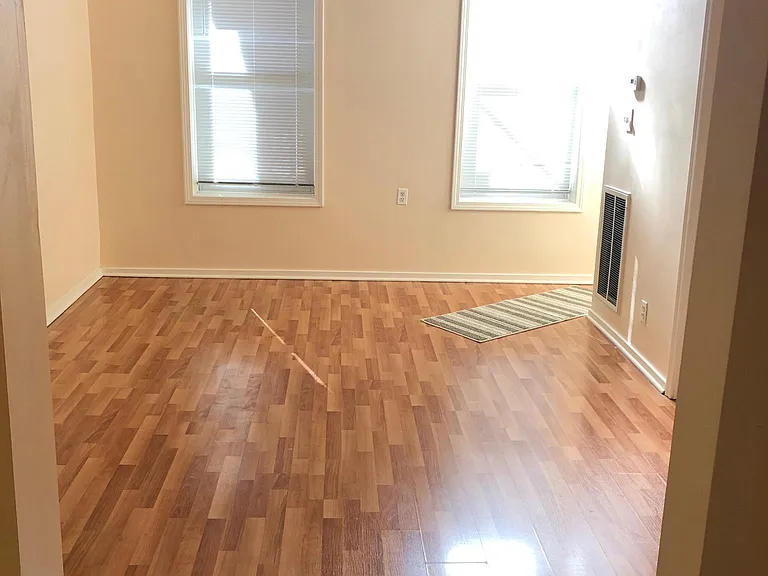 Large, sunny living room with 2 windows,