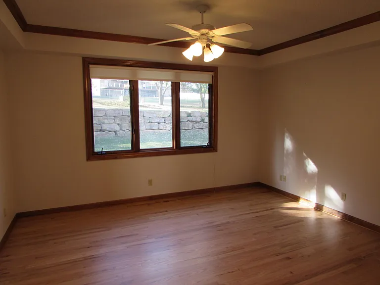 Master bedroom with crown molding on main floor