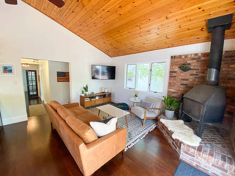 open concept living space with functional woodstove