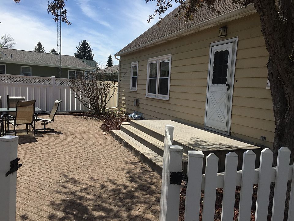 Landscaped back yard with fp