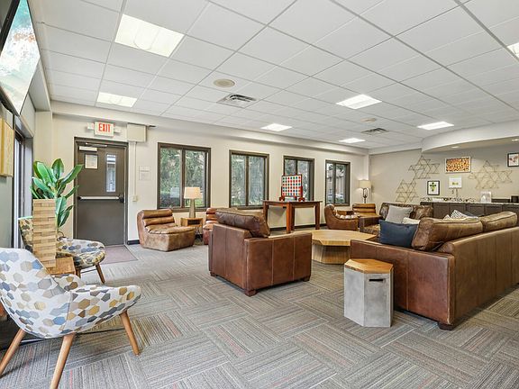 Socialize and relax in the spacious clubhouse at University Oaks Apartments in Kent, OH.