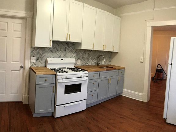 Extra tall kitchen cabinets, matte brass hardware