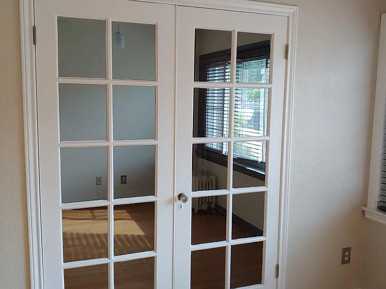 French doors to 2nd bedroom/office. Off living room.