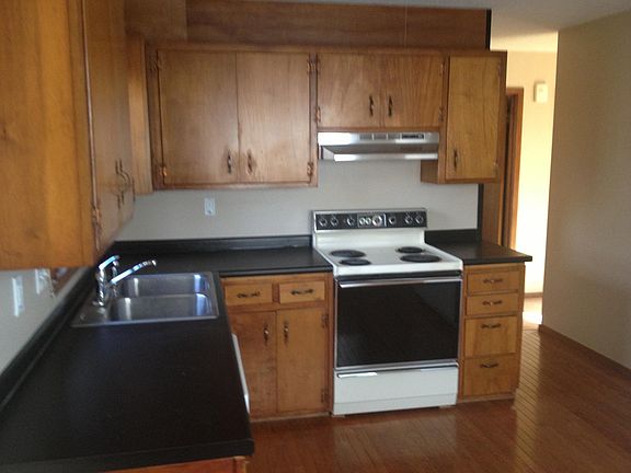 Hard wood floors, fairly new counter top, electric stove, s.s.sink, refrigerator, north-western exposure