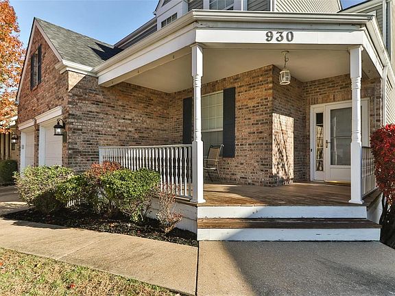 The inviting wood front porch welcomes you into the home.
