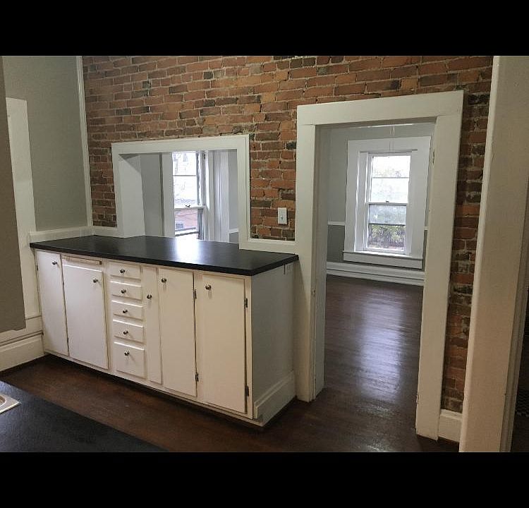 Fully renovated kitchen area overlooking the dining/living room