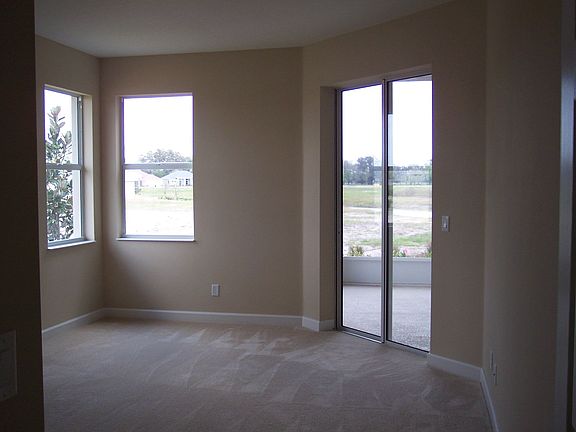 Master Bedroom w/sliders to Lanai and waterviews