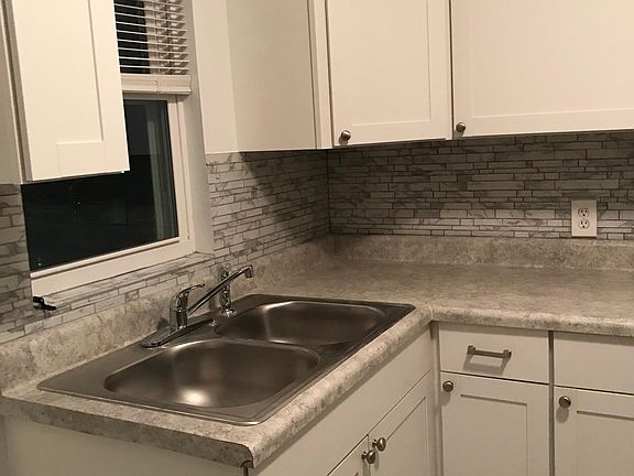 All new kitchen cabinets and window