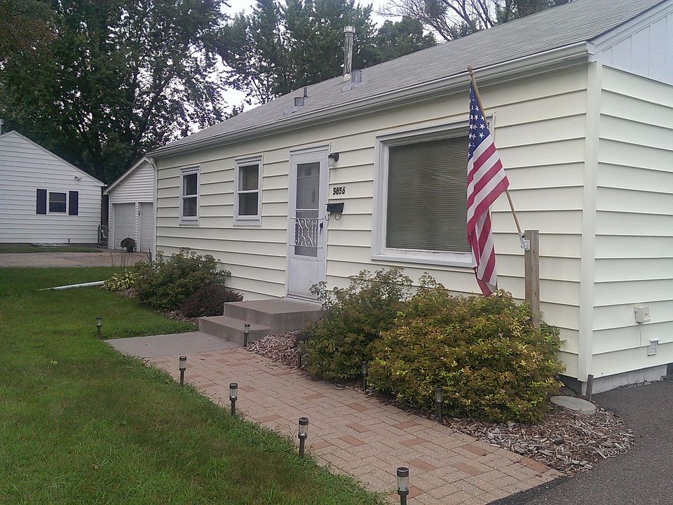 Front of the home with bice landscaping.