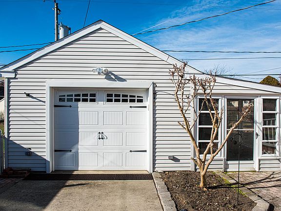 detached garage with adjoining sunroom