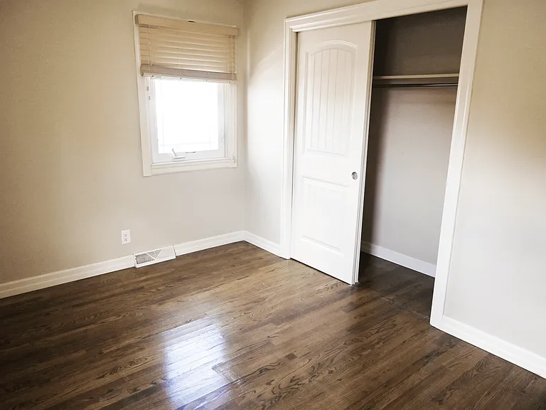 Large closet in bedroom at Square 131 5-Plex.