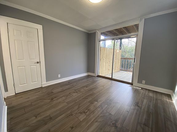 Bedroom 1 with Balcony overlooking backyard