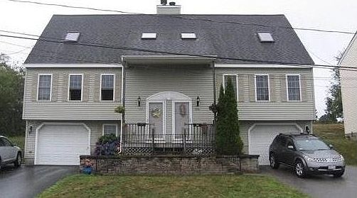 Unit is an attached single family seen on the Right.