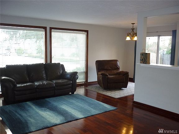 Floor to ceiling windows and slider make this main floor living are light and bright! Cherry hardwood flooring