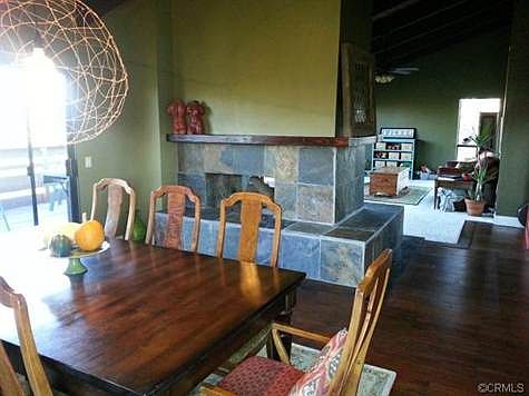 Dining Room with view into Living Room and 2 sided fireplace