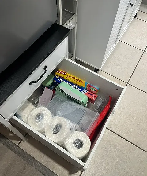 Fully stocked with tupperware etc.