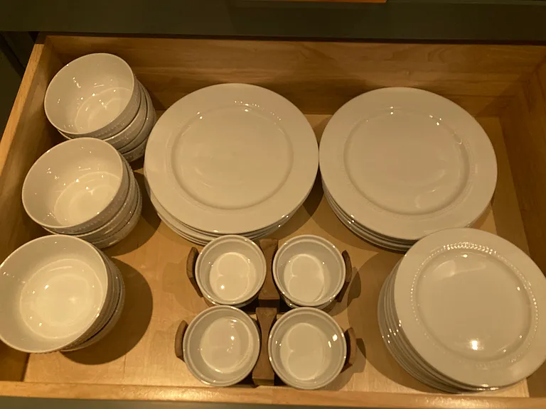 Complete and elegant dinnerware set for guest comfort.