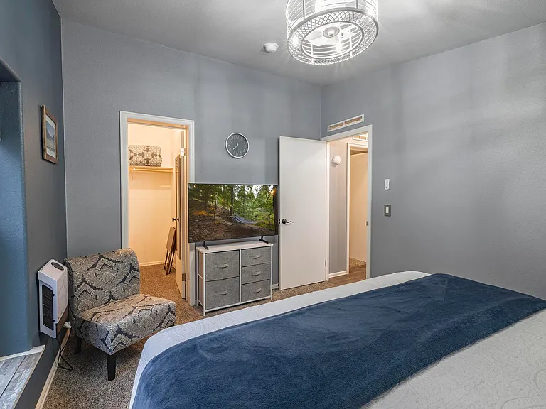 King bed inside bedroom 2 with smart tv