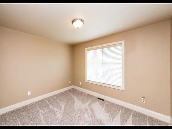 Two upstairs bedrooms with large closets and windows with exceptional natural light and full bath.